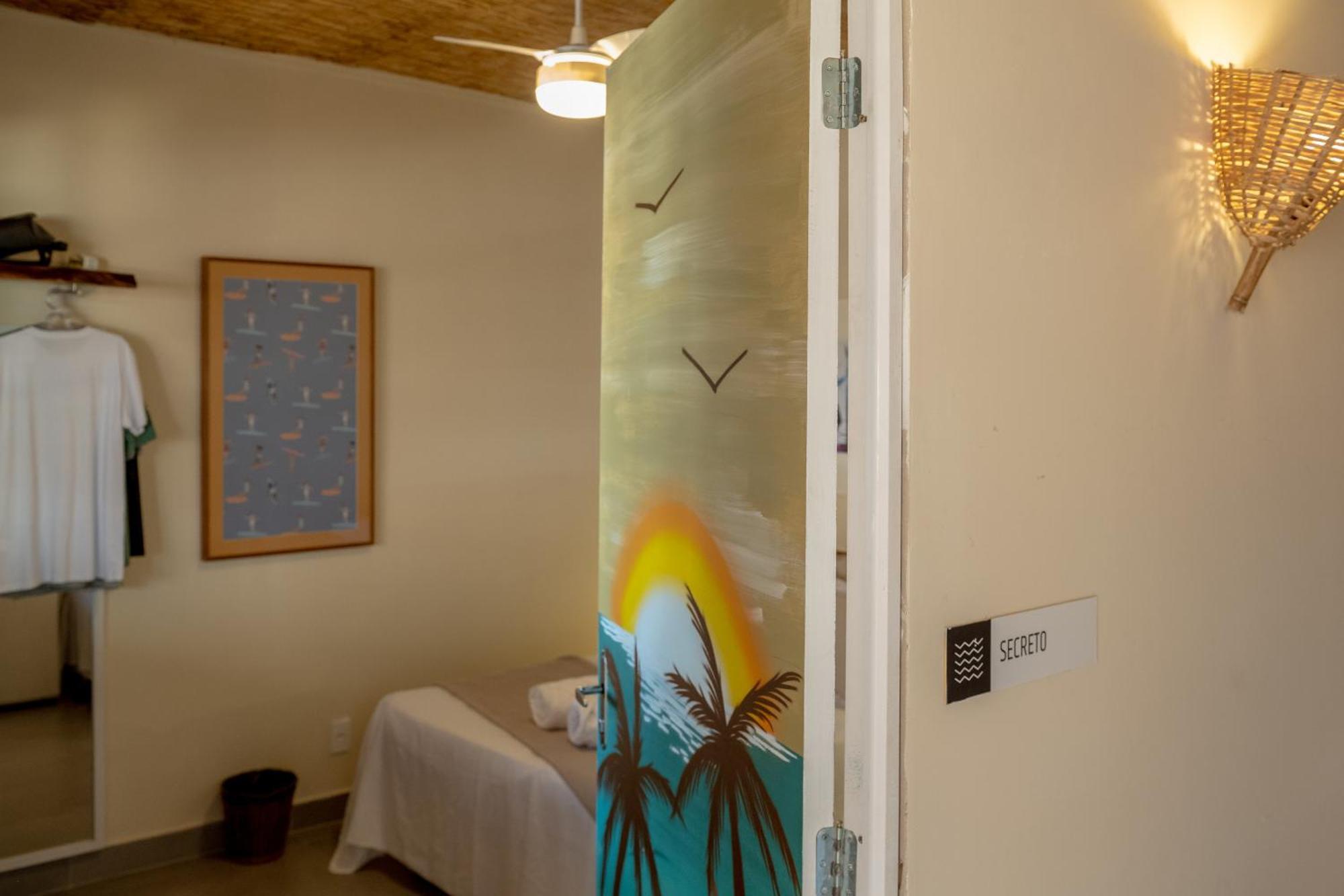 Quarto Triplo com Banheiro Compartilhado